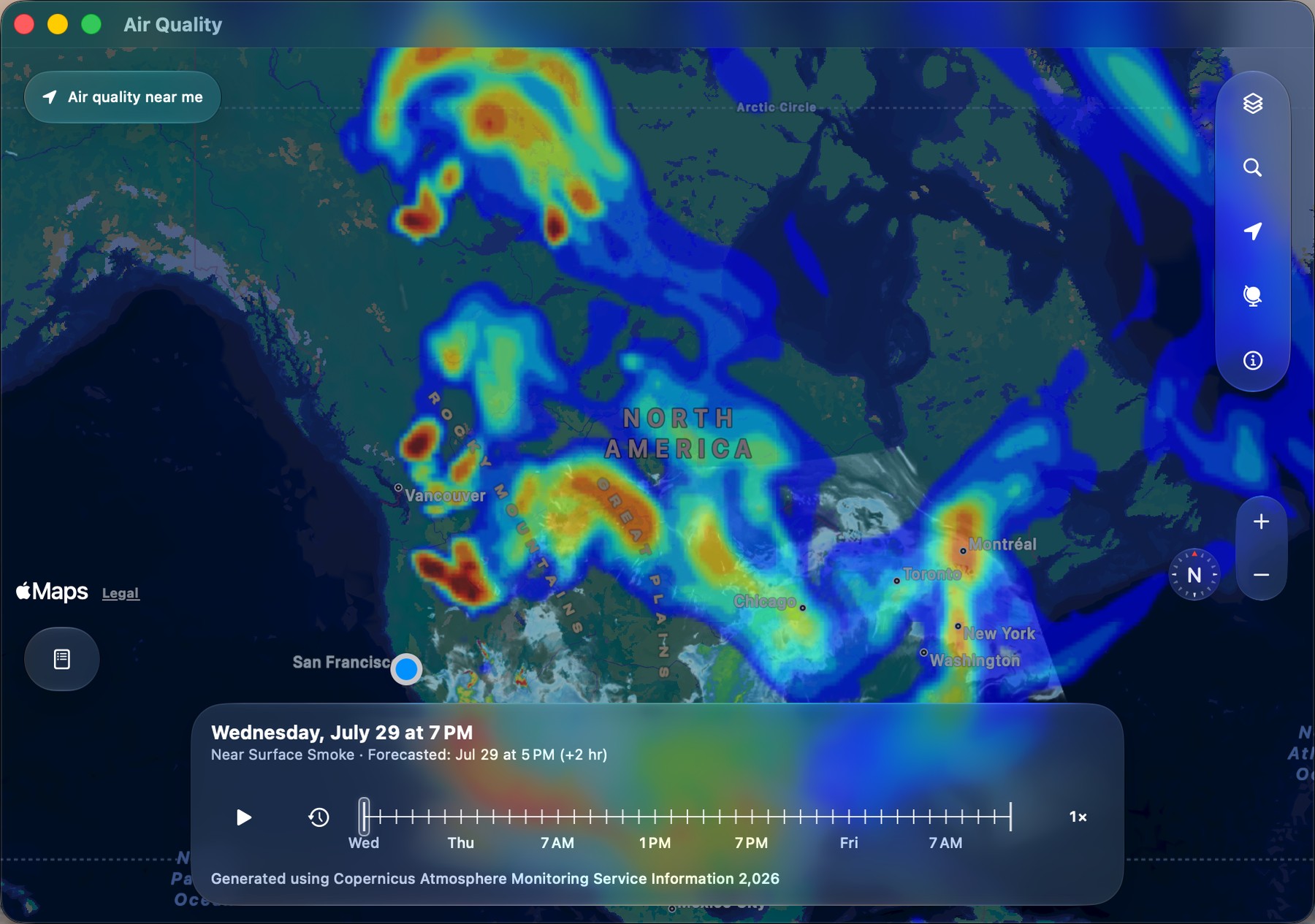 Air Quality Index on macOS: a resizable window showing the near-surface smoke forecast across North America, with Liquid Glass map controls, zoom and compass on the right, and the forecast timeline docked at the bottom reading Wednesday, July 29 at 7 PM.